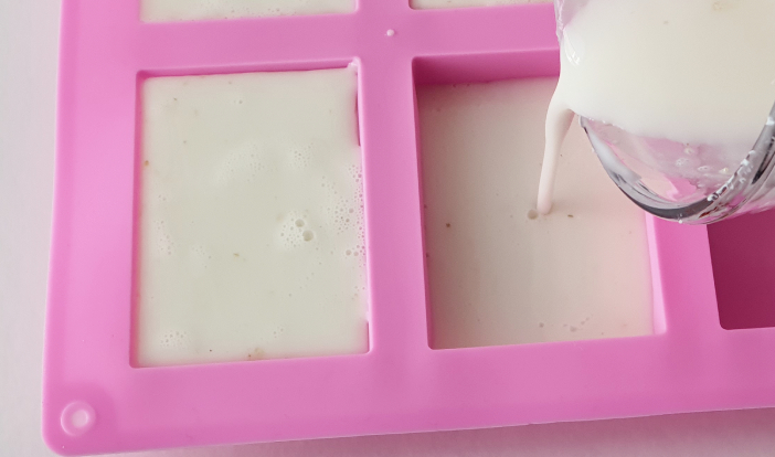 pouring the soap base into the mold